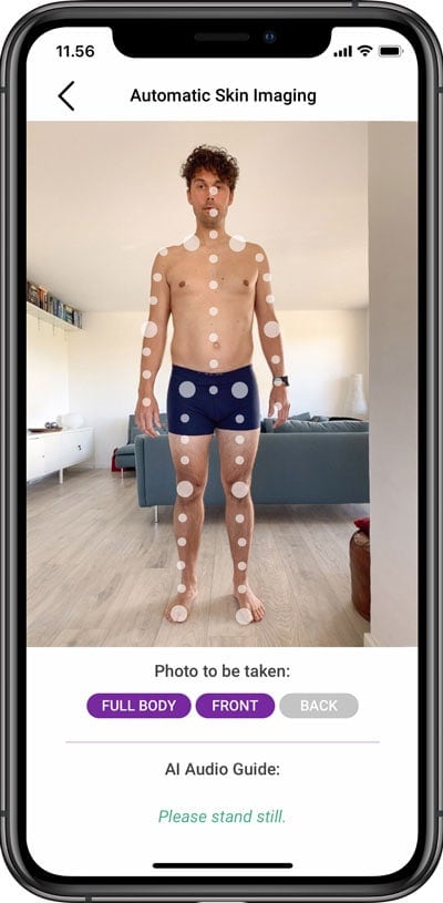 man getting photo taken by automatic skin imaging