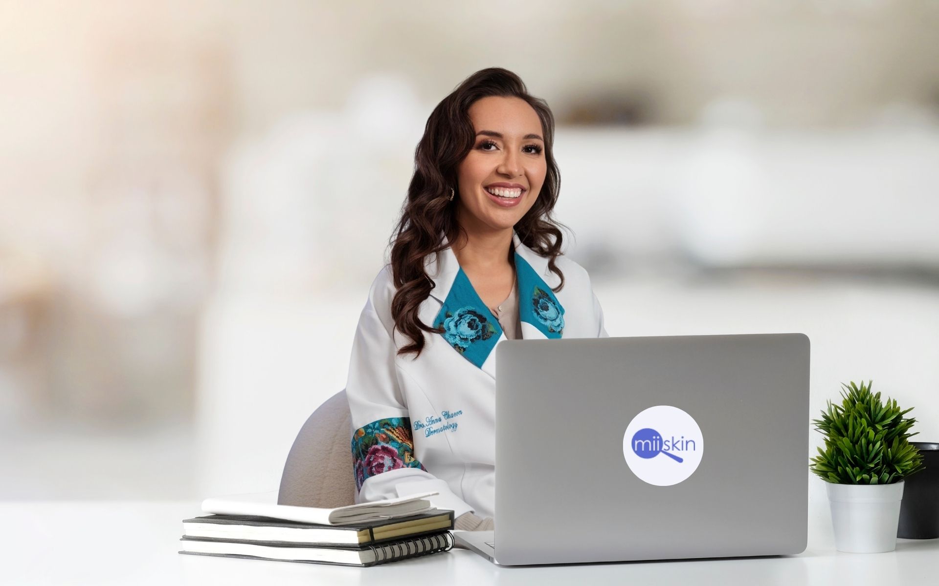 dr. anna chacon md, board-certified dermatologist, providing teledermatology care using a virtual dermatology platform.