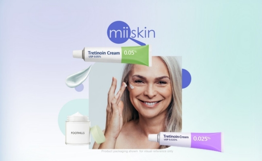 tretinoin guide for patients – woman applying cream to her face with tretinoin creams visible around her.