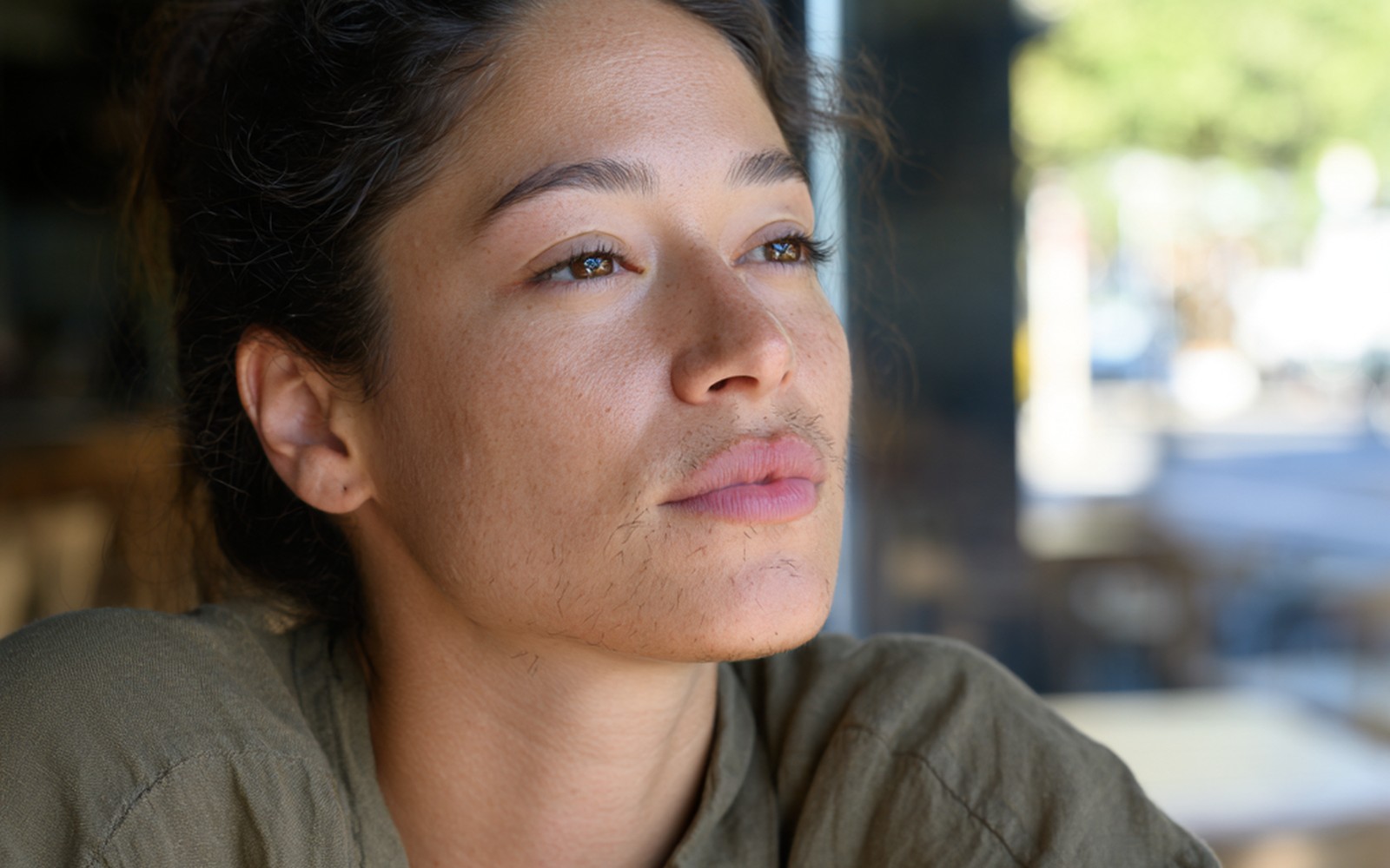 woman with facial hair Woman with visible facial hair growth around her upper lip, chin and jawline