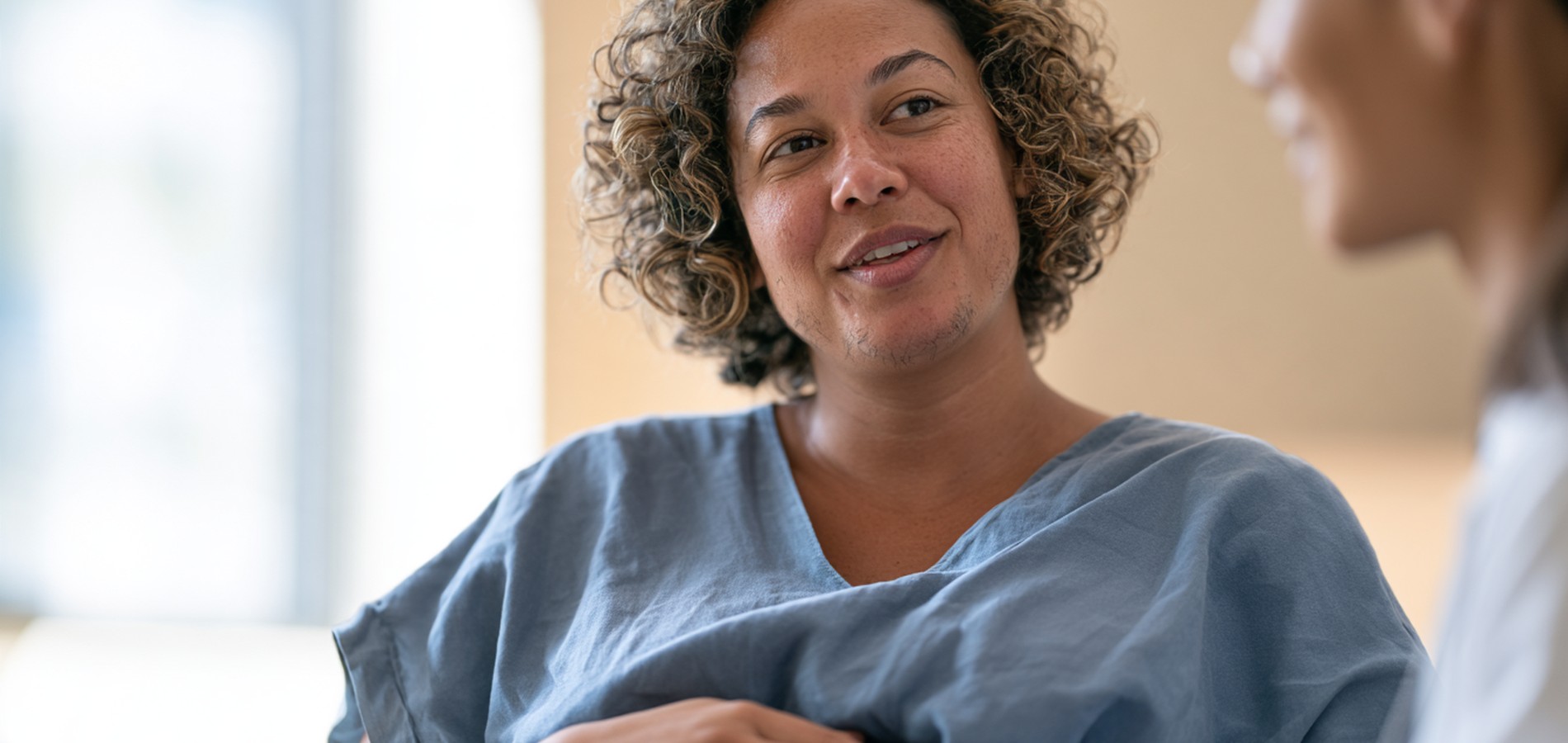 Hirsutism during pregnancy Pregnant woman talking with a healthcare professional during an appointment